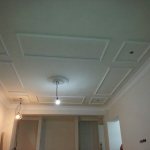 Photo of a plasterboard ceiling in a corridor in a panel house